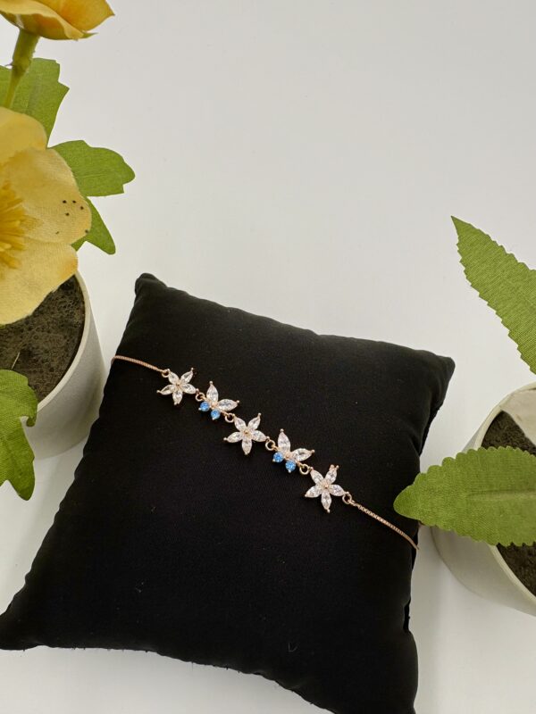 92.5 Sterling Silver Rose Gold-Plated Starflower Bracelet with CZ and Blue Accent