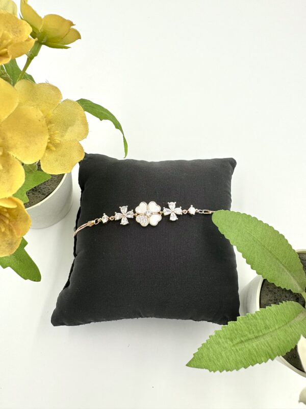 92.5 Sterling Silver Floral Charm Bracelet with White and CZ Accents